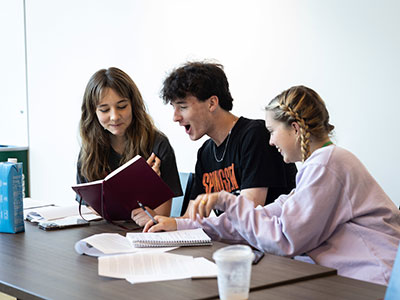 Students laughing during Writers Week class