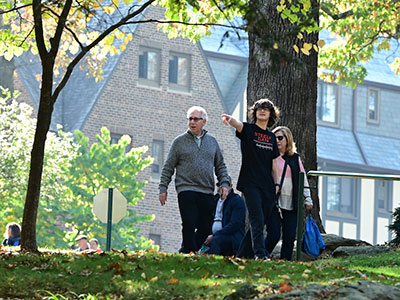 A family walking down the hill to Bates