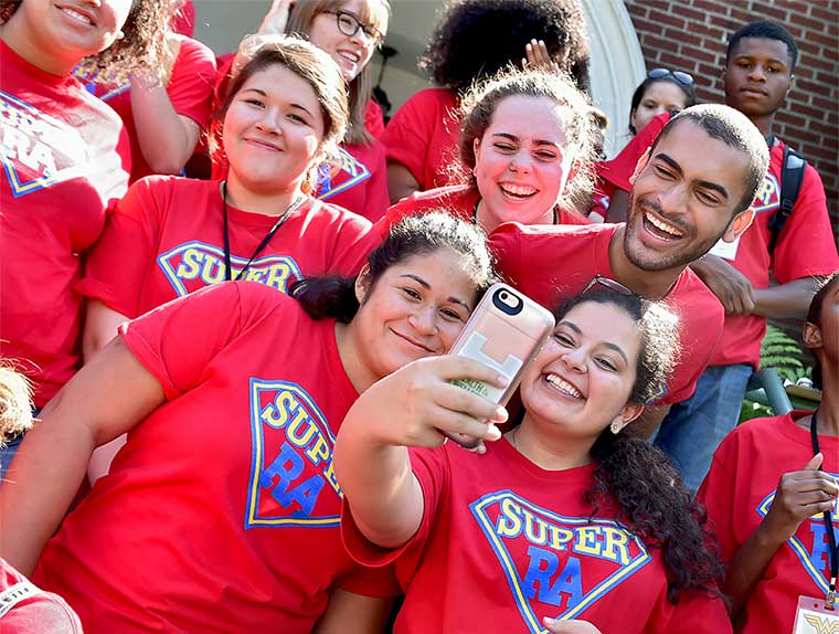 Students smiling and taking a selfie