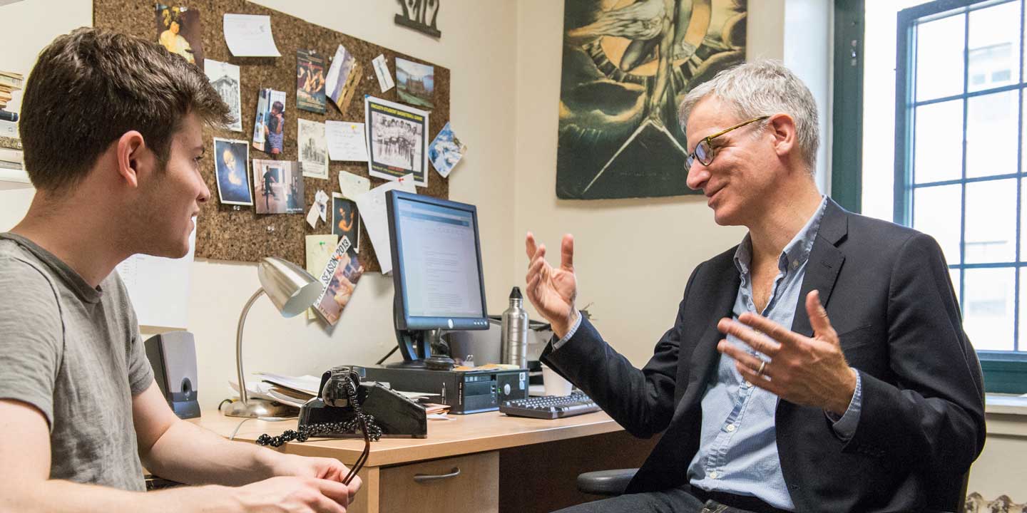 Student meeting with faculty member