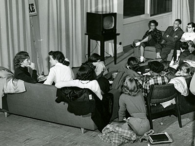 Students gathered around a television watching the McCarthy hearings