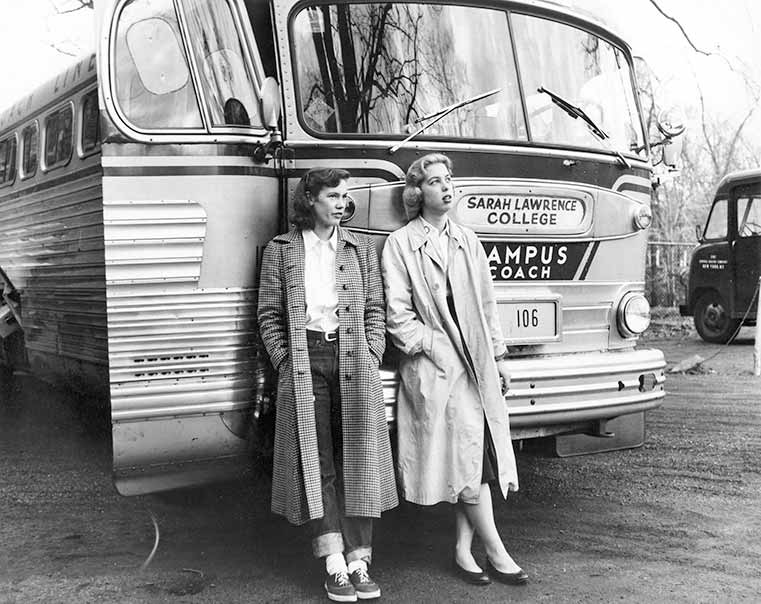 Students standing in front of bus