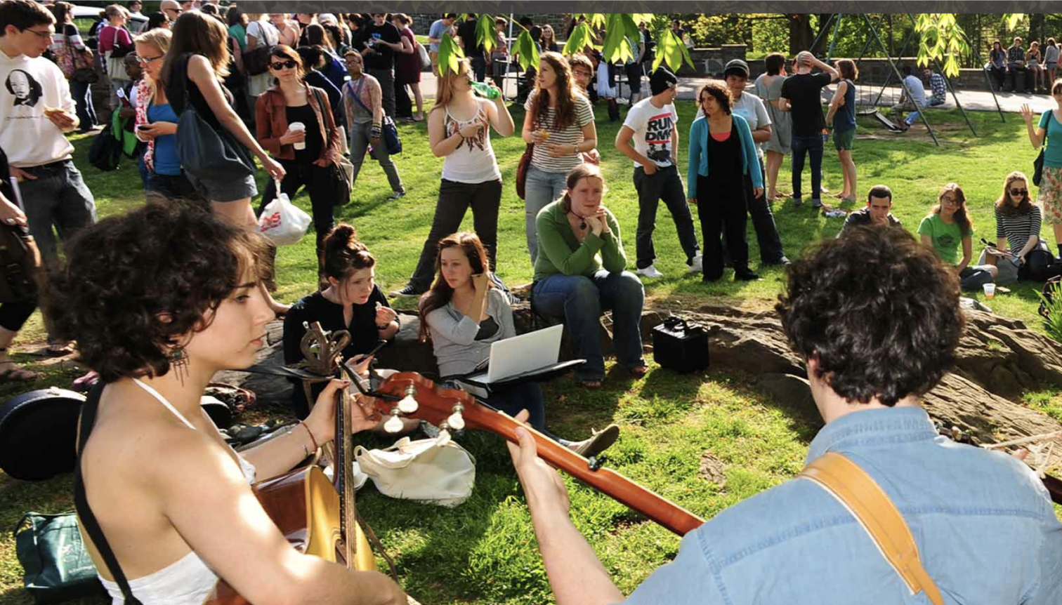 students performing music in front of a crowd outdoors