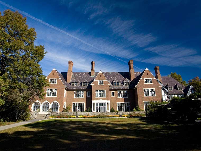 Large tudor style building, blue sky