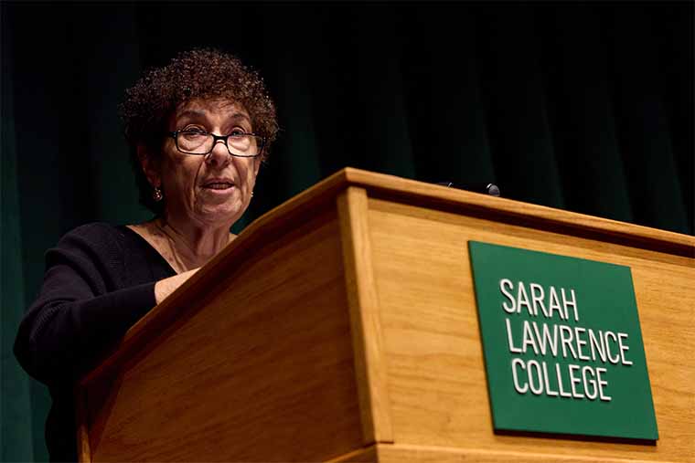 person speaking at lectern 