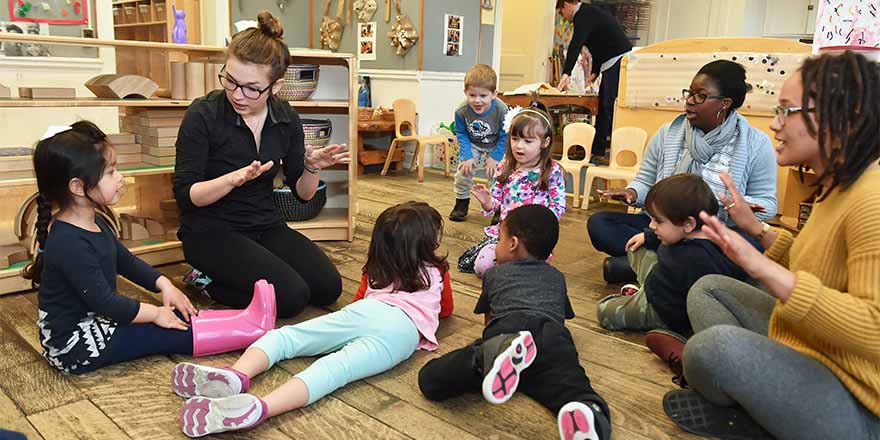 Student teaching assistants doing fieldwork at ECC with pre-school children