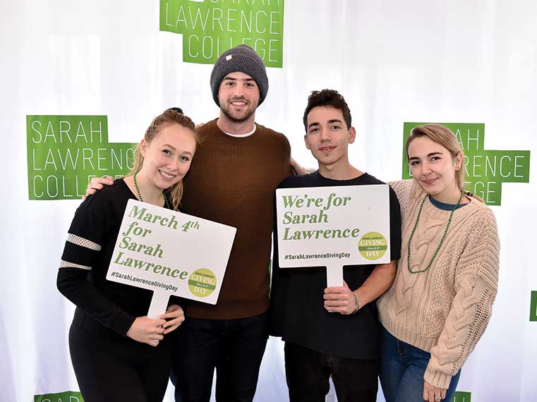 Students with Giving Day Signs