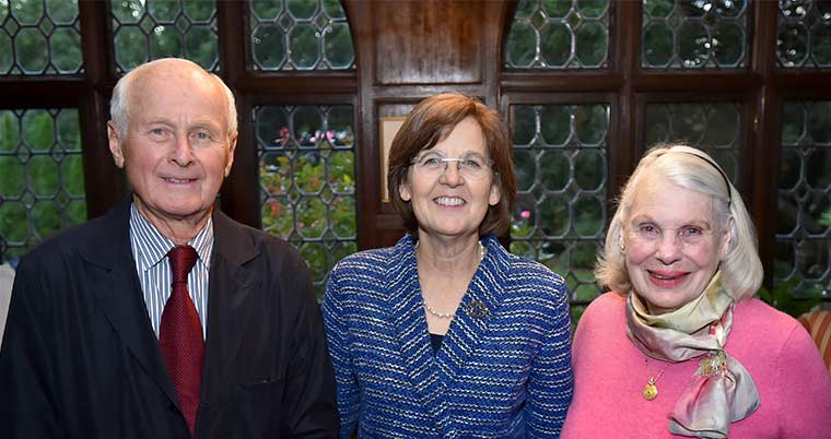 Portrait of Si and Vicki Ford standing with Cristle Collins Judd