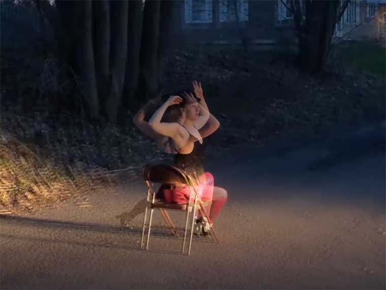 Person sitting in chair blurred showing motion