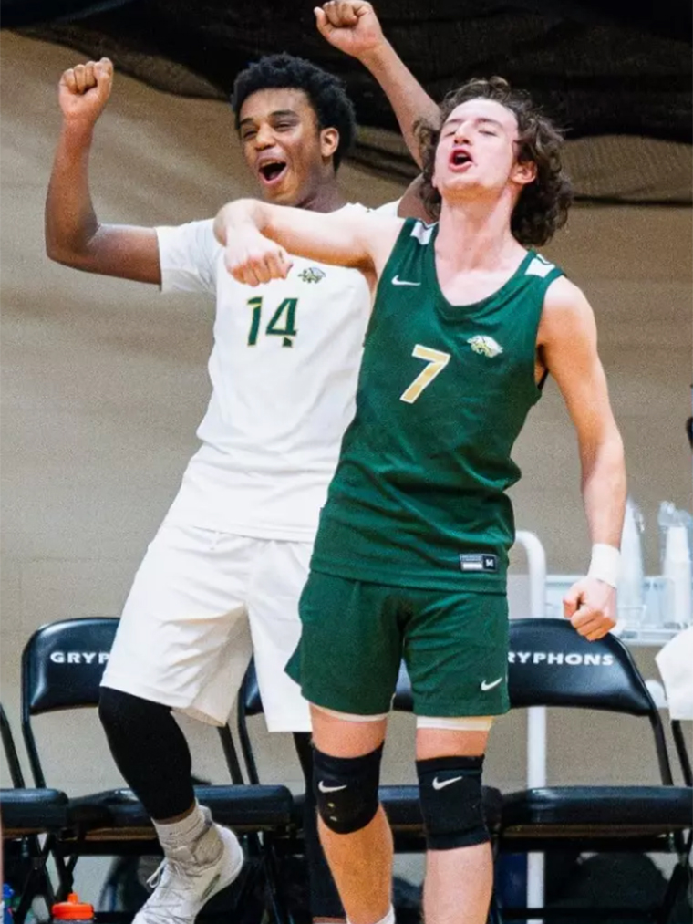 Two student athletes celebrate