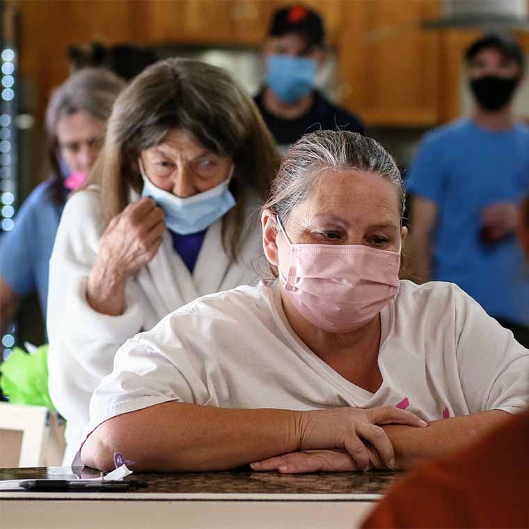 nursing home residents sitting at tables