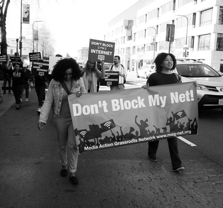 Cyril's wife (far right), Alana Devich-Cyril '97, marching at a Bay Area rally