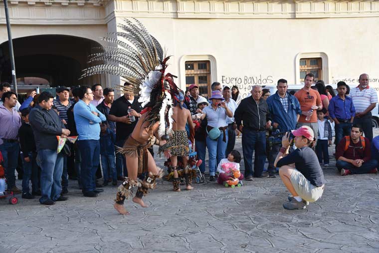 Crowd gathered to view a street performance