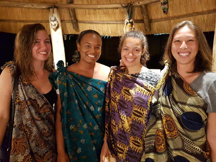 Four students posing in traditional Botswani clothes