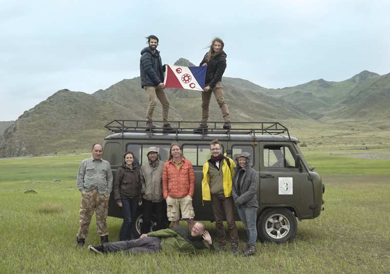 The project team proudly carries Explorers Club Flag 134 into the "Siberian Valley of the Kings" in the remote Altai Mountains of Central Asia