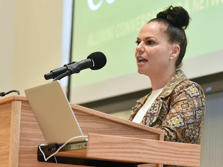 Sanaa Hamri speaks at a podium