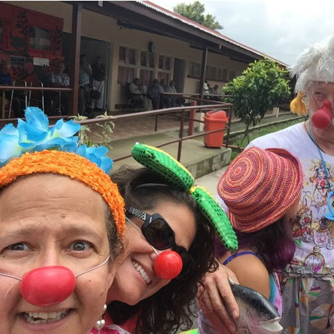 Women with red clown noses on
