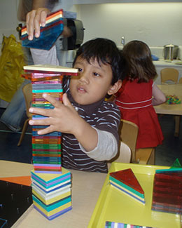 Child stacking blocks