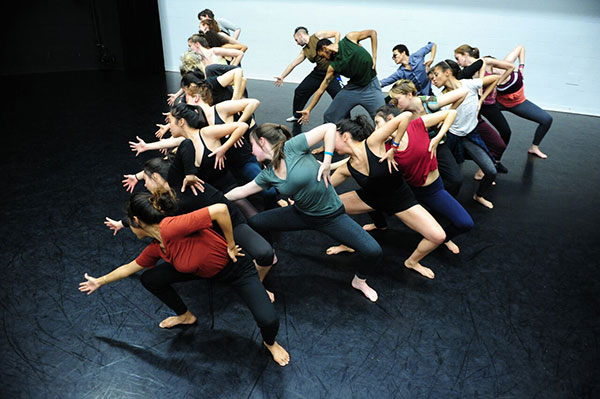 Dancers posing in a V formation