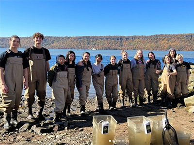 Students on the banks of the Hudson River