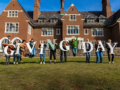 Students holding letters that spell out Giving Day