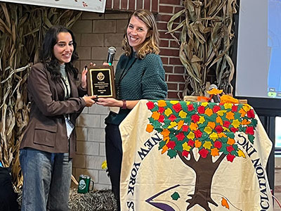 Ishika Joshi receiving an award
