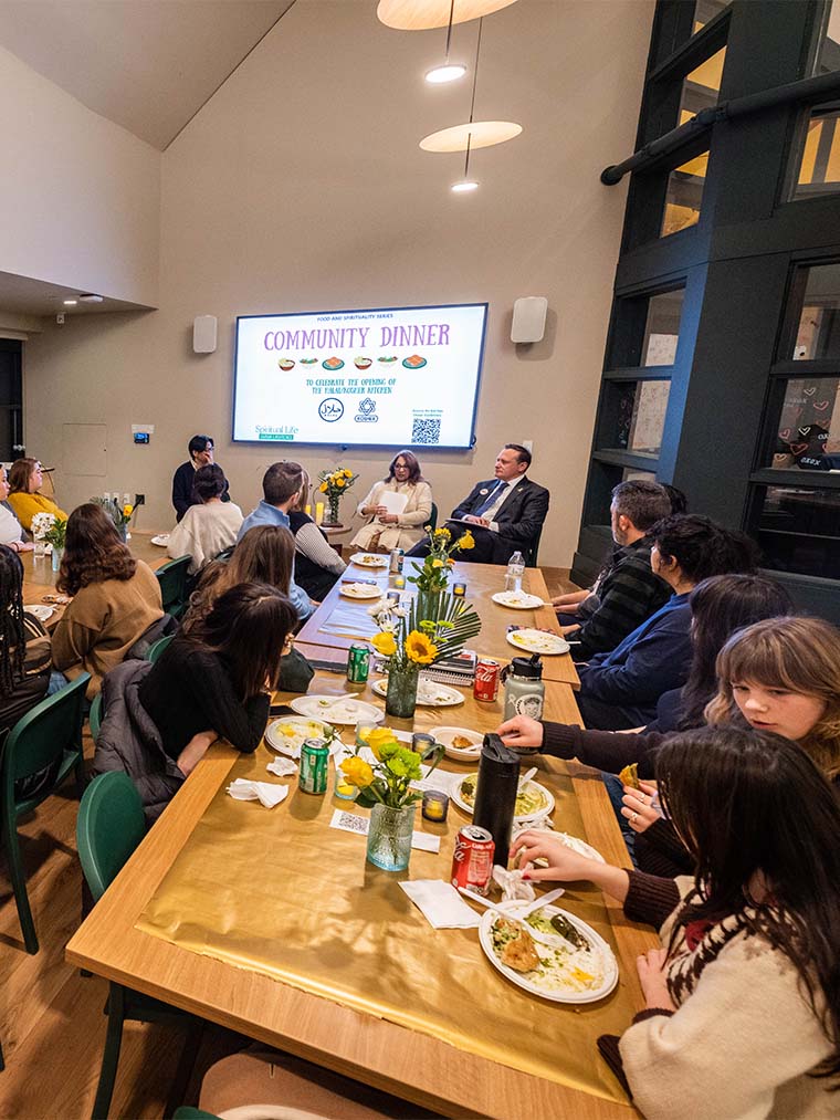 Large group of people eating at tables