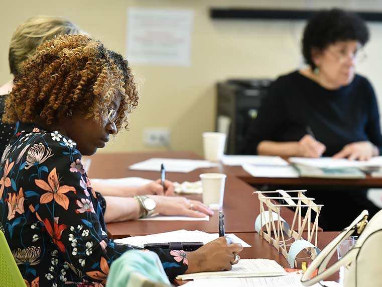 Student taking notes