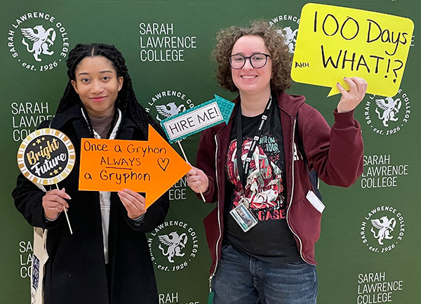 Students posing in front of SLC backdrop