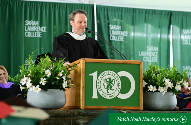 Noah Hawley speaking at the podium with a call to action to click to watch his remarks