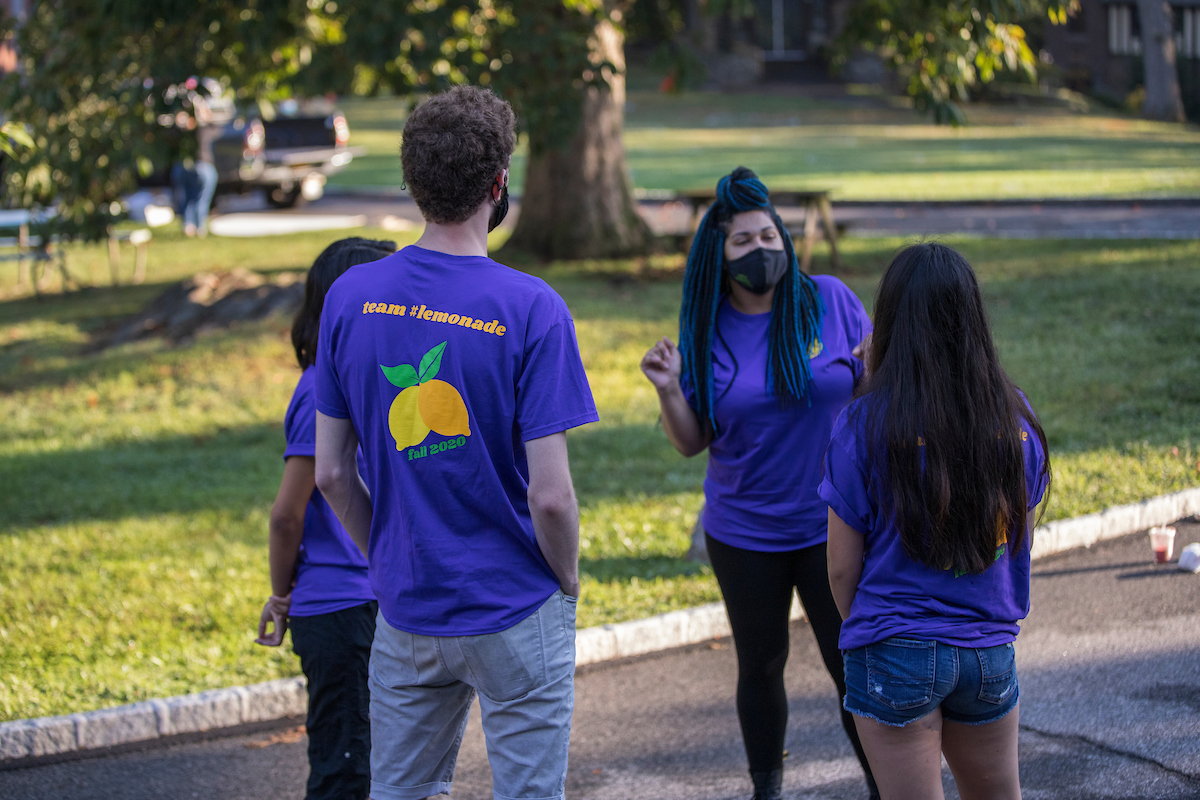 Students in a circle wearing shirts that say Team Lemonade