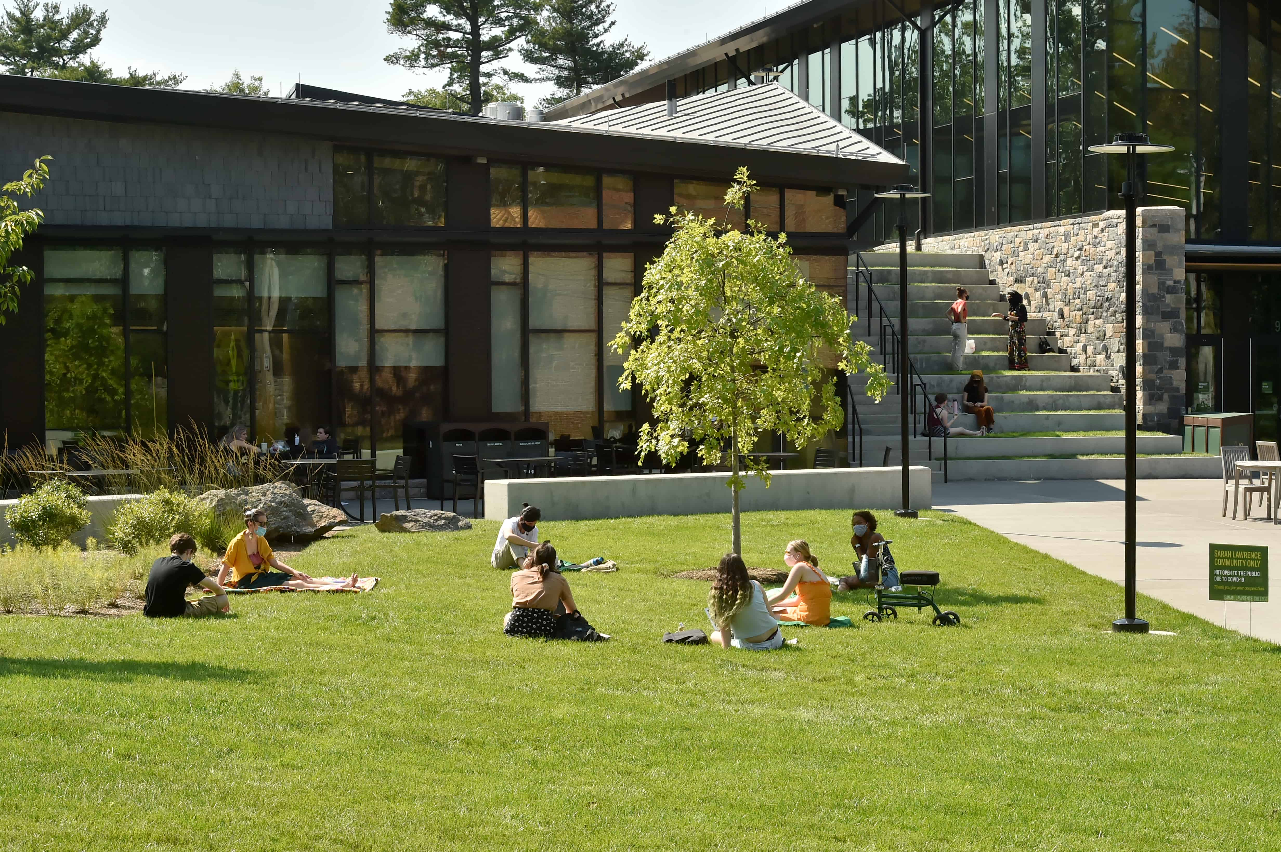 Students socializing on the Campus Center lawn at the start of the fall semester