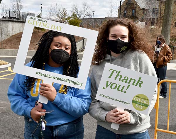 Students holding Thank You signs