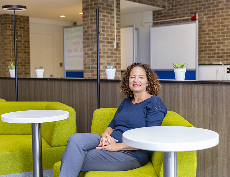 Rachelle Rumph sits in The Learning Commons