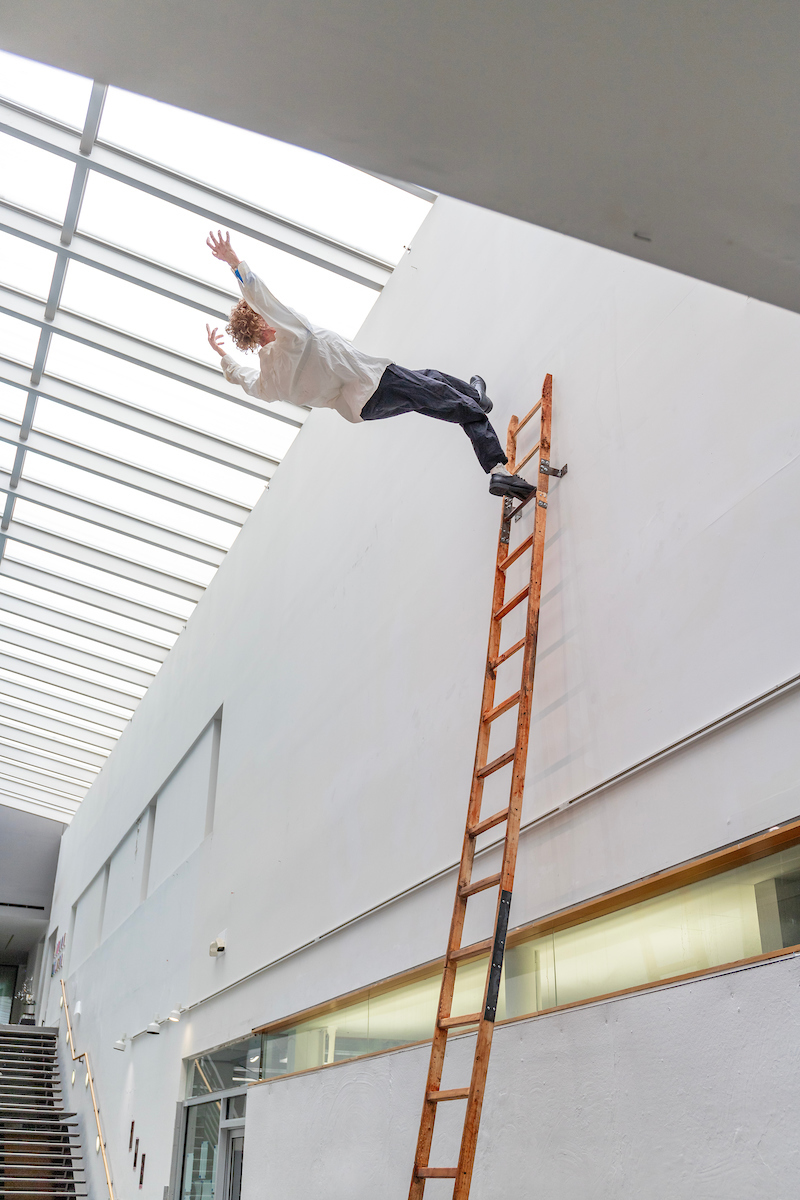 Sculpture showing person falling from ladder