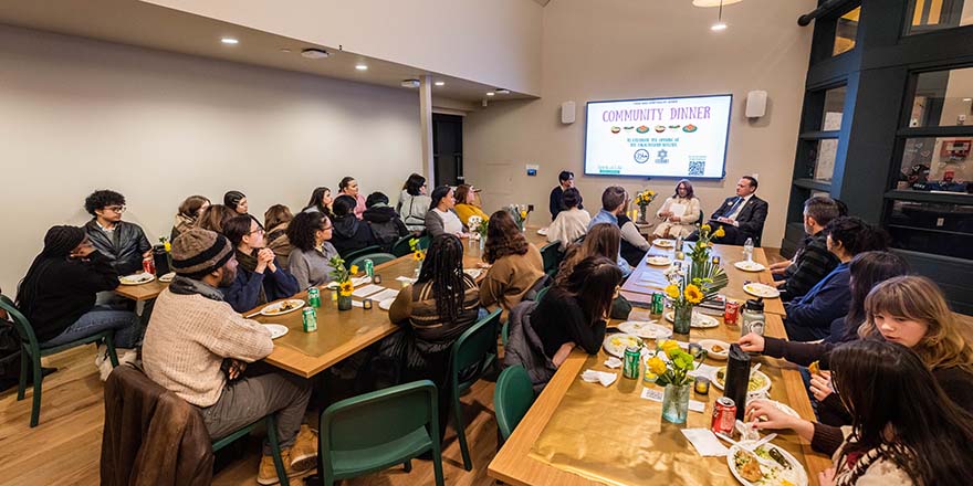 A large group of people sitting at tables