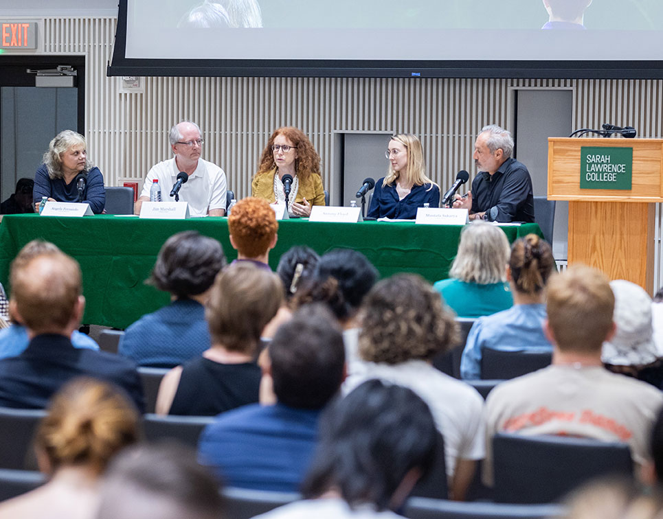 Faculty panel with audience in the foreground