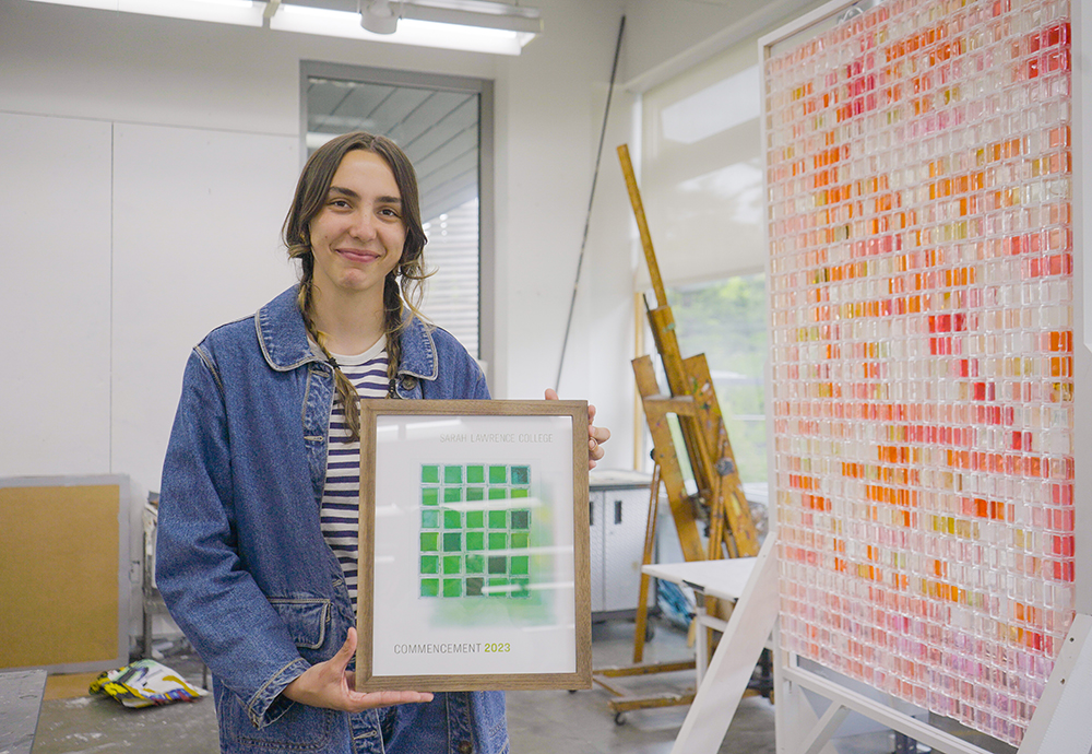 Avery Moore poses with her artwork