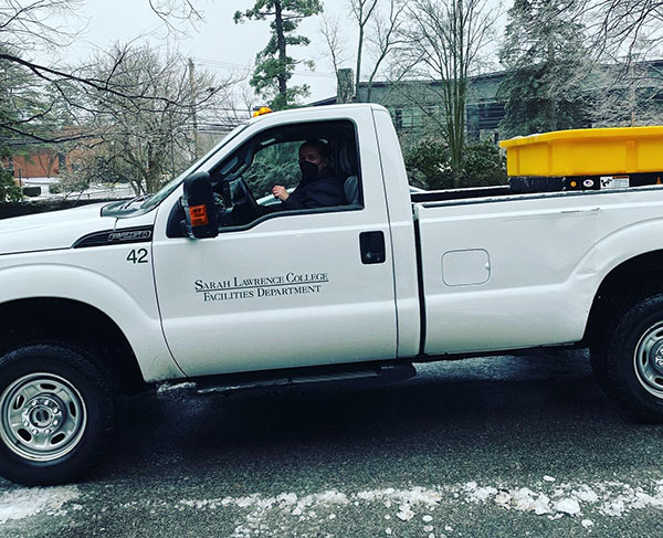 Photo of woman driving pickup truck