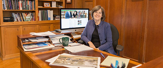 President Cristle Collins Judd sitting at desk