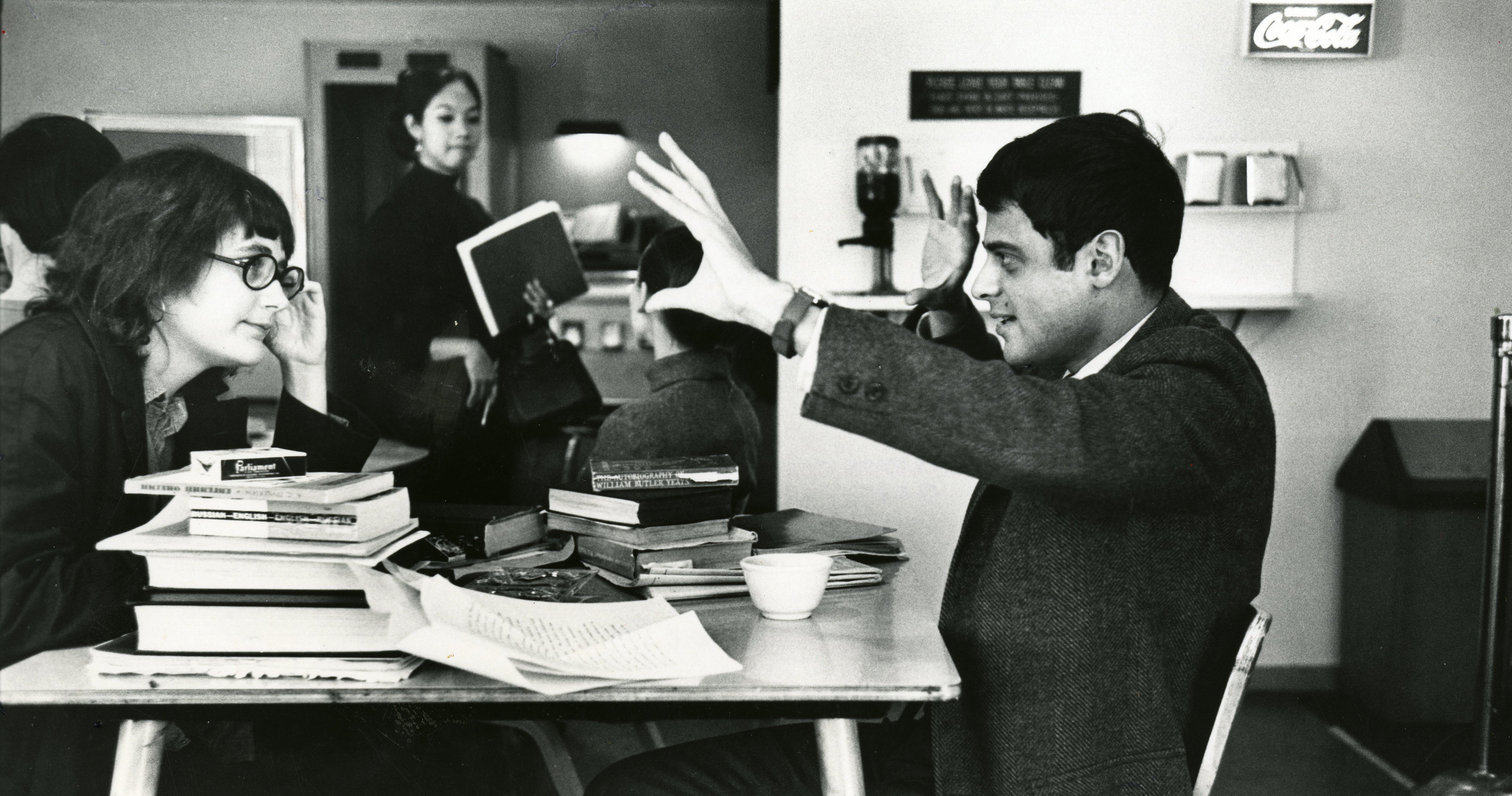 Faculty emeritus Danny Kaiser engaged in a conversation with a student