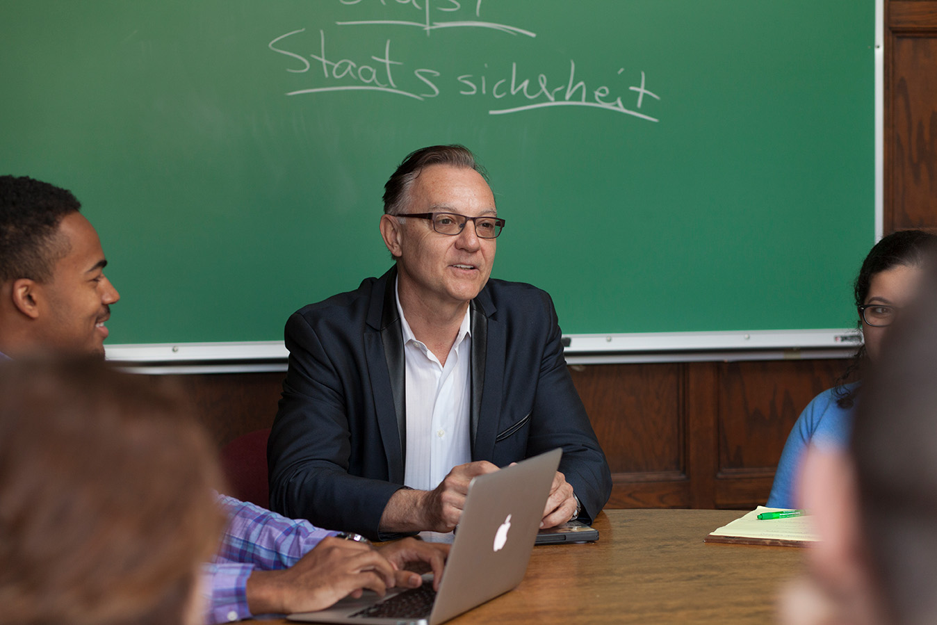 Roland Dollinger at a round table with students