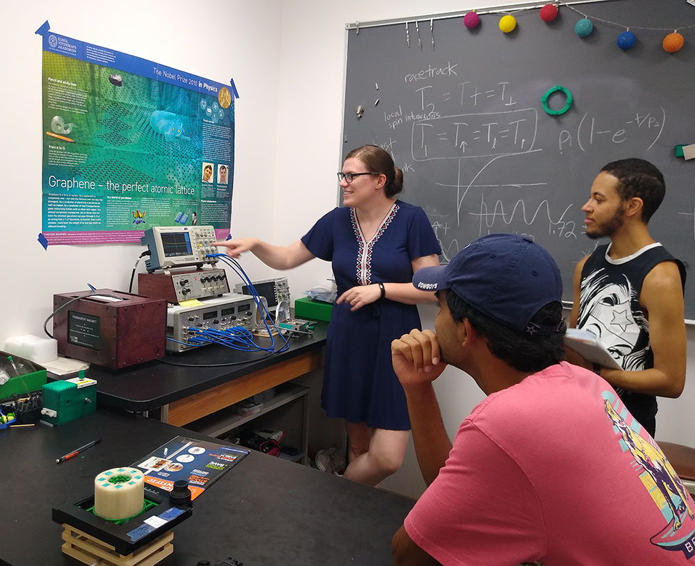 Physics faculty member Merideth Frey with students