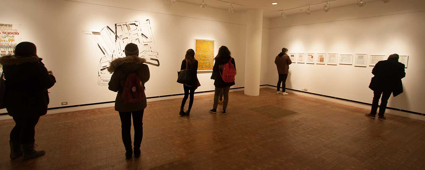 People viewing an exhibit at the Heimbold Gallery