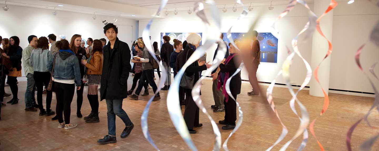 People viewing an exhibit at the Heimbold Gallery