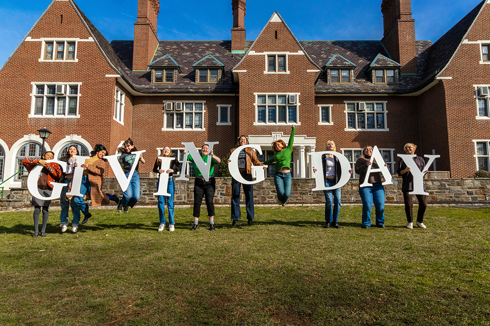 Students holding letters that spell out Giving Day