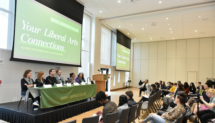 Panelists sitting at table