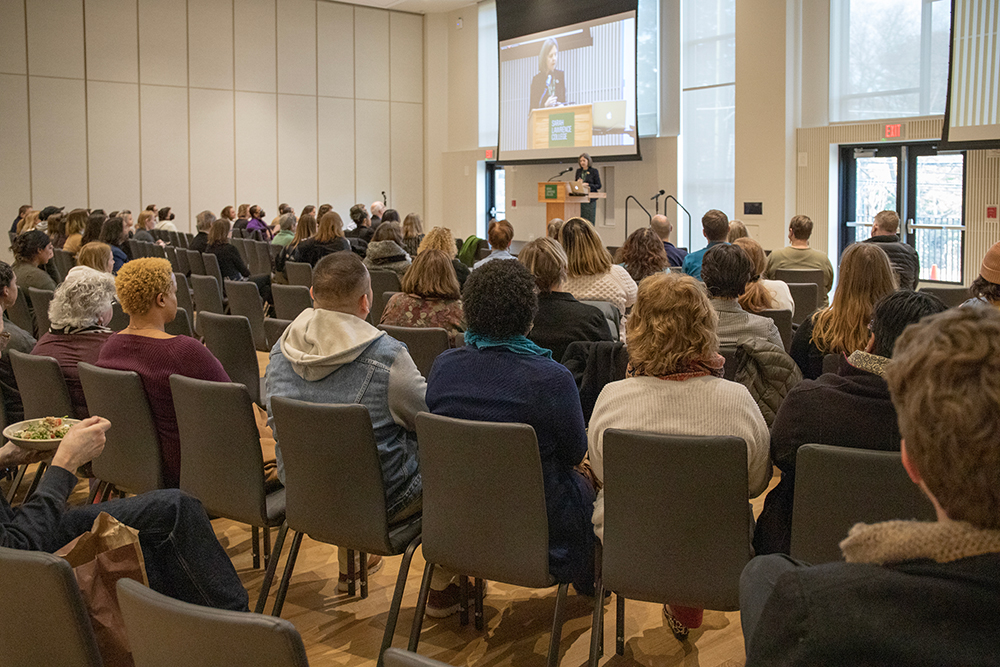 Faculty and staff watch President Judd speak