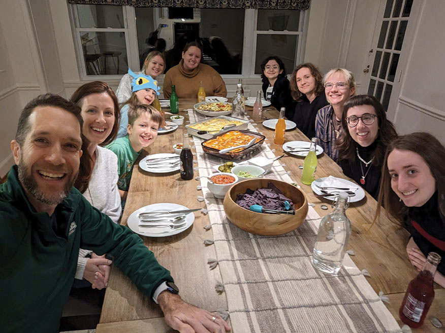 Dave Stanfield and family enjoy dinner at home with Sarah Lawrence students