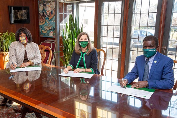 The presidents of WCC, SLC, and BCC gathered around a table